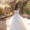 Ruffle skirt beaded bodice wedding dress