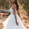 Ruffle skirt beaded bodice wedding dress