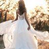 Ruffle skirt beaded bodice wedding dress