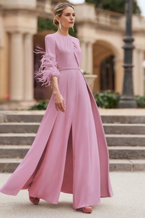 Rosa Clara couture, occasion wear jumpsuit with cross front detail, feather sleeves, and maxi overskirt. Colour variations available.
