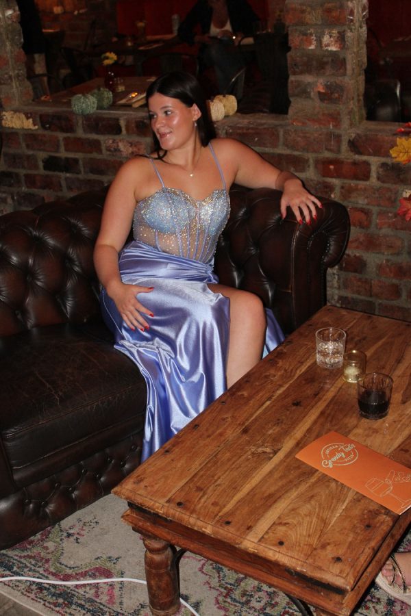 Satin prom dress with leg split and notch detail. illusions bodice covered with sparkle details and corset back