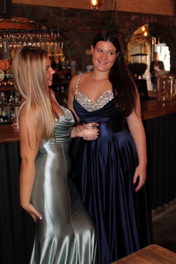 Satin A-line gown with leg split, cowl, and embellished bust detail