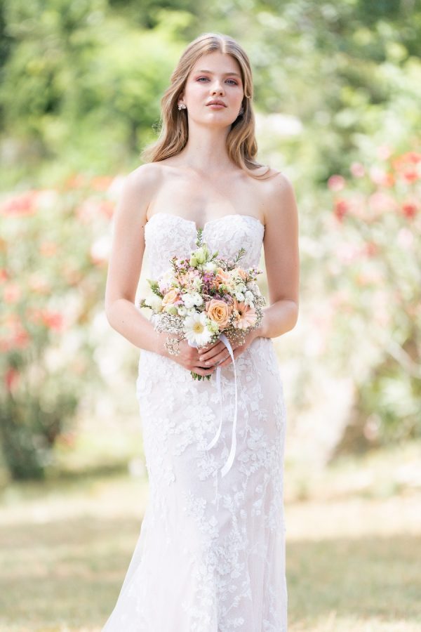 Accented with sequined, beaded lace appliques over Chantilly lace, this strapless sheath gown is truly timeless. Allure Romance - R3802