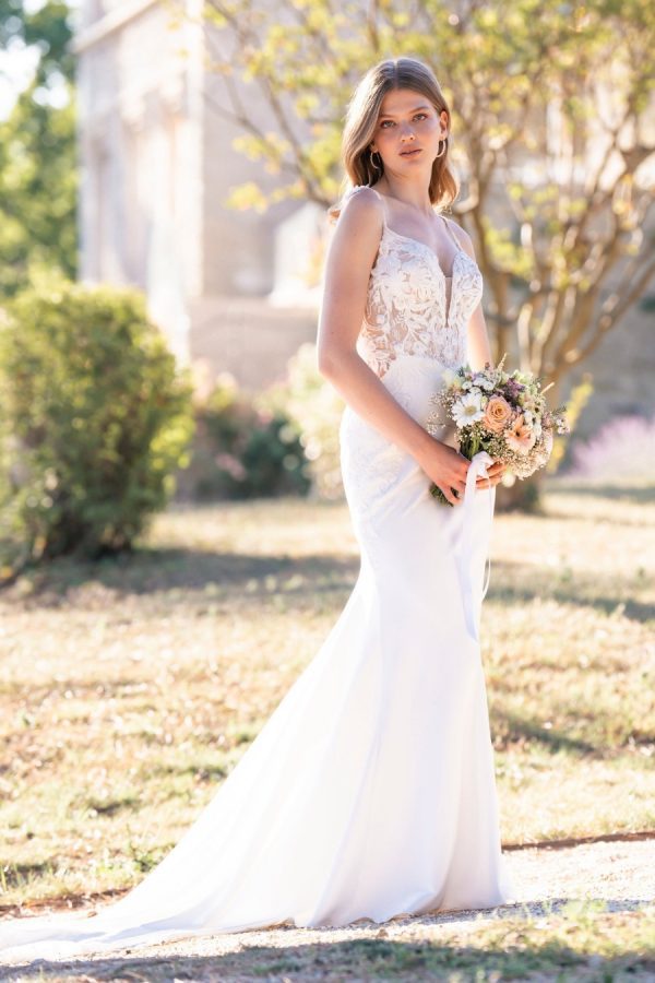 This stretch satin sheath features beaded, sequined lace appliques along the sleeveless bodice and along the illusion hemline. Allure Romance - R3804