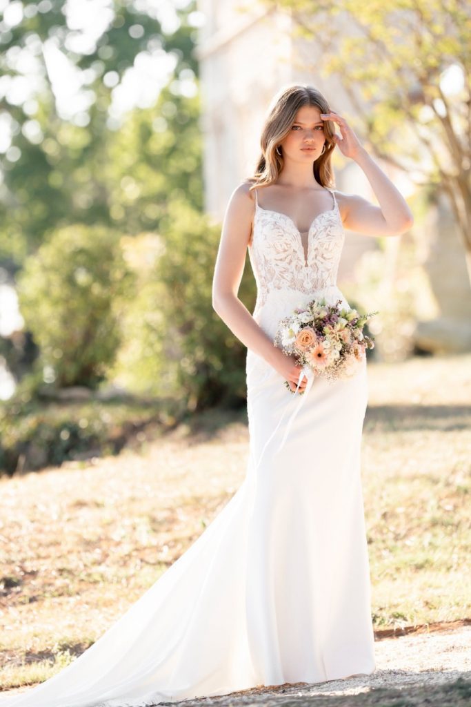 This stretch satin sheath features beaded, sequined lace appliques along the sleeveless bodice and along the illusion hemline. Allure Romance - R3804