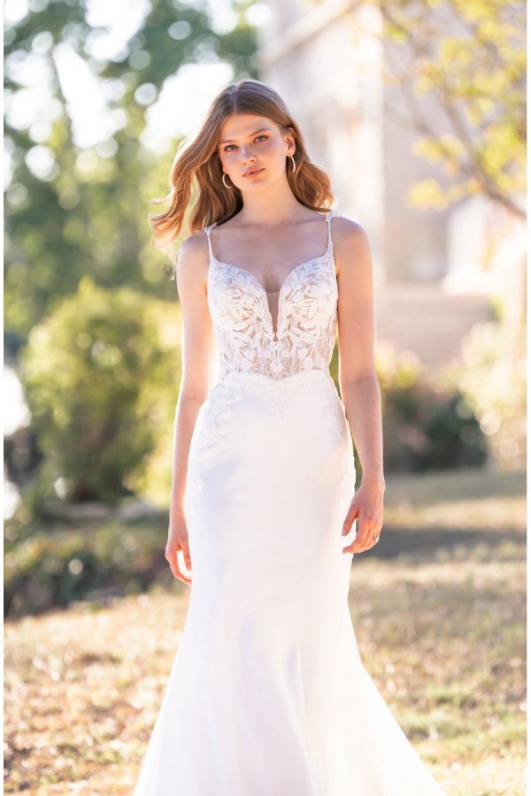 This stretch satin sheath features beaded, sequined lace appliques along the sleeveless bodice and along the illusion hemline. Allure Romance - R3804