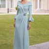 Rosa Clara flute sleeve cross front dress with embellishment detail in petrol blue