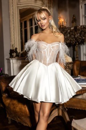 Rosie has a pleated satin skirt with a chantilly lace bodice with boning and feather sleeves.