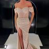Full beaded fitted gown with wrap style skirt and leg split. Bardot sleeves and corset back finish the bodice off. TNP250