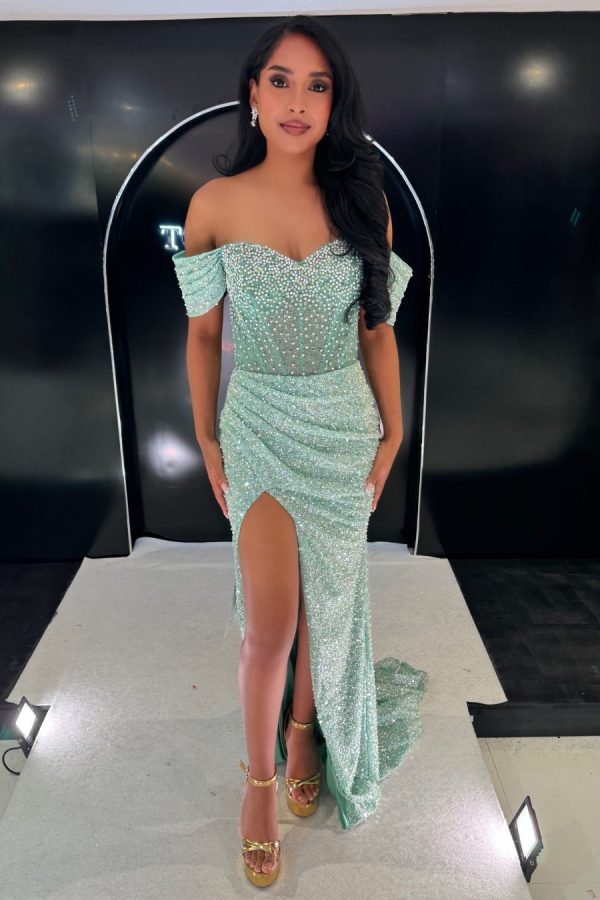 Full beaded fitted gown with wrap style skirt and leg split. Bardot sleeves and corset back finish the bodice off. TNP250