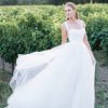 Contrasting textures in the form of Mikado and tulle are the perfect pairing in this sleeveless ballgown, finished with side panel cut outs and a tapered back. Allure Romance - R3807