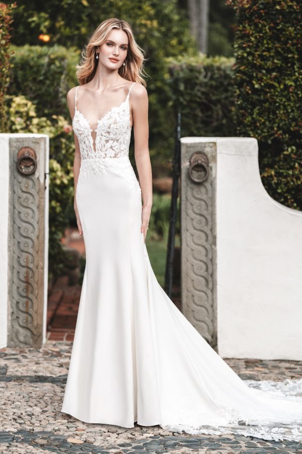 This curve-hugging crepe sheath gown is accented with a matte floral lace bodice and appliqued illusion train.