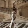 Diane by Milla Nova. A Sophisticated mermaid gown in Mikado with masterful drapery accentuating the hips. Featuring a heart-shaped neckline with integrated cups, a structured corset, a lace-up closure at the back, and a form-fitting mermaid skirt with draping on the hips and a short train.