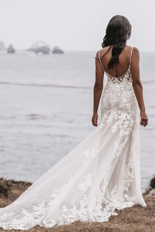 Isla by Allure Romance. A bridal dream come true -- dreamy lace appliqués trail the bodice and hemline of this sheath gown. 3505