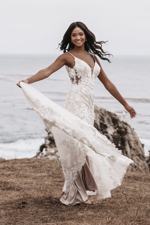 Isla by Allure Romance. A bridal dream come true -- dreamy lace appliqués trail the bodice and hemline of this sheath gown. 3505