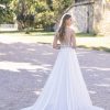 Connie by Allure Romance. Dimensional beaded lace appliques embellish the bodice of this A-line gown, which is finished with a skirt composed of tulle over crepe.