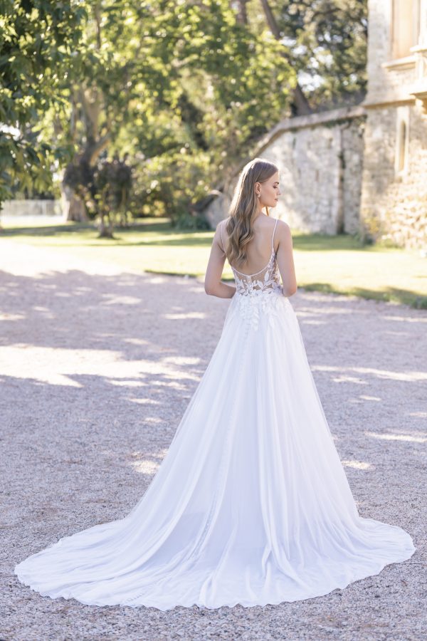 Connie by Allure Romance. Dimensional beaded lace appliques embellish the bodice of this A-line gown, which is finished with a skirt composed of tulle over crepe.